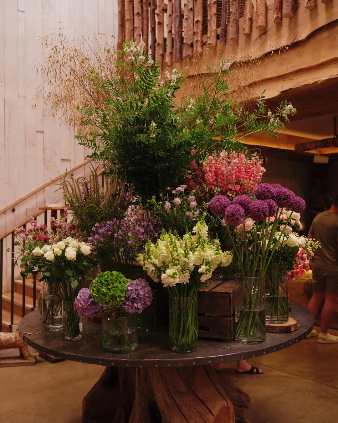 Cut flowers on a round table in the shop